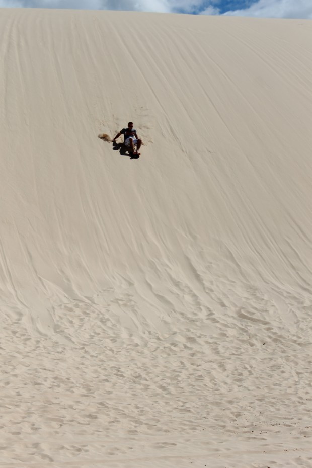 Sandboarding at Birubi Beach